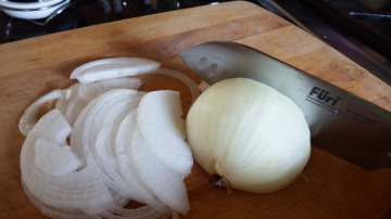 I cut the onion in half and lay the flat side on the cutting board...easier to slice