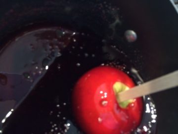 Tilt deep saucepan and gently swirl the apple