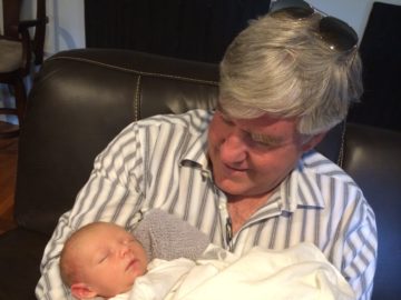 Grandfather with 3 week old great grandchild....hair is not dark anymore! :)