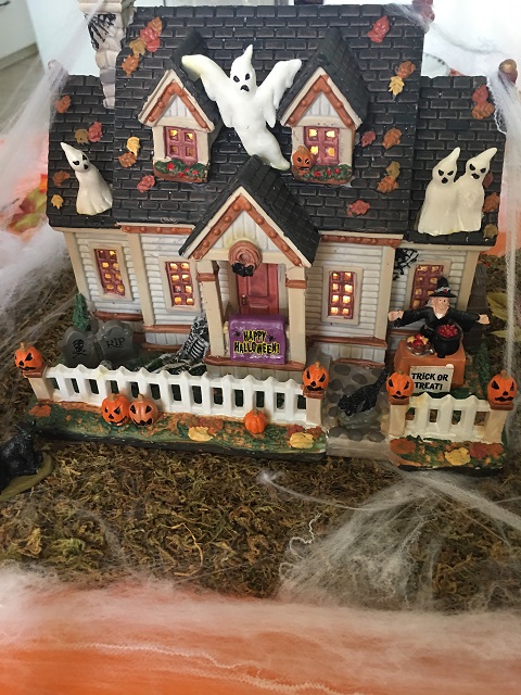 A dark and stormy night halloween story haunted house centerpiece.