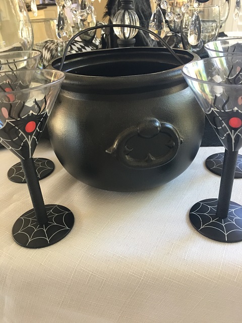 black cauldron and wine glasses