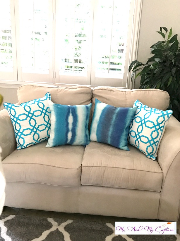 blue pillows on coastal living room sofa