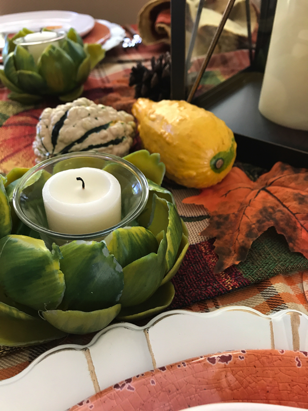 Autumn dining with artichoke votive candles.
