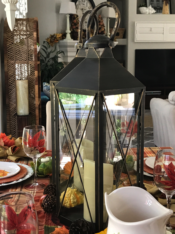 Autumn dining table with tall lanterns.
