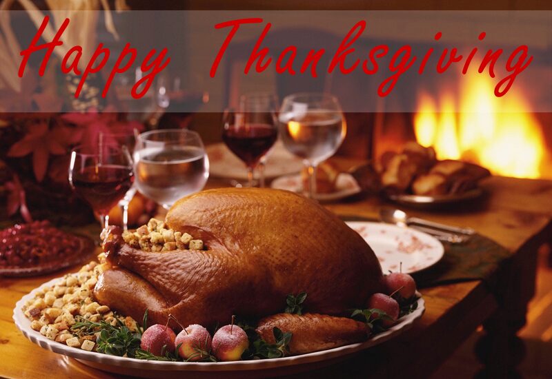 Roast turkey centerpiece with wine glasses and fire