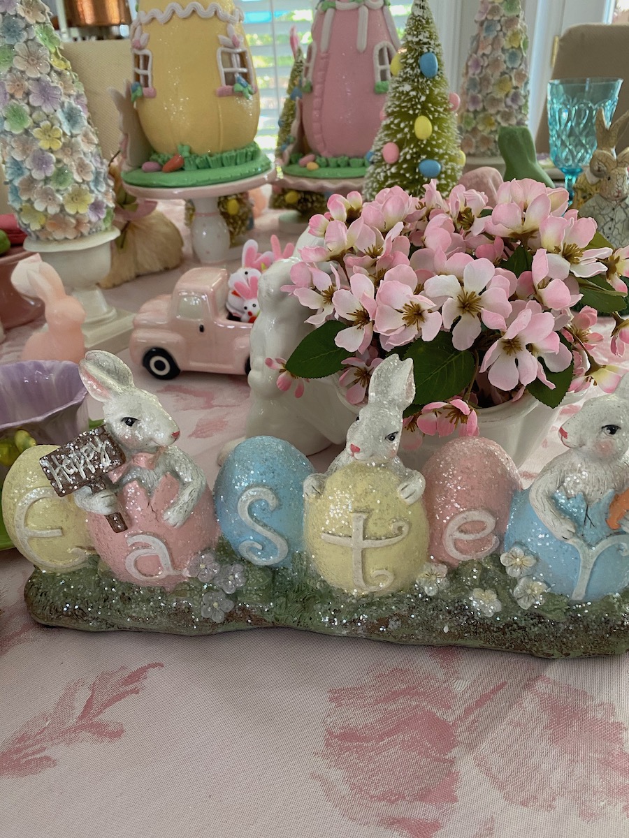 Easter bunnies spelling out Easter using pastel pink and blue.