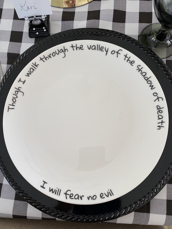 Bible scripture written on the rim of dinner plate.