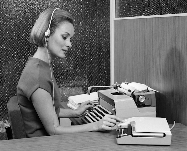 secretary using dictaphone machine